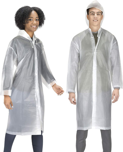 Family wearing matching rain ponchos at theme park attraction