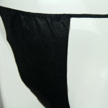 Stack of disposable thong panties from 100-pack bundle