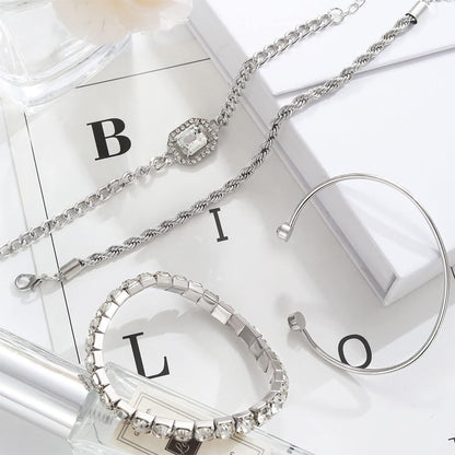 Adjustable layering bracelets stacked on woman's wrist together