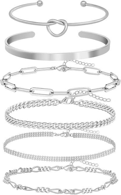 Gold and silver plated bangle bracelets layered on wrist