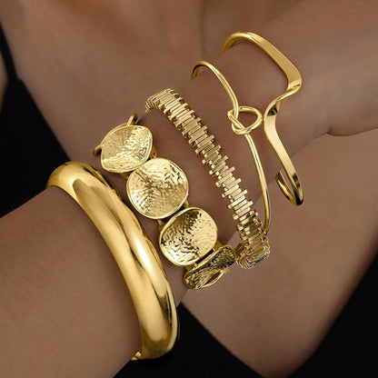 14K gold bangle bracelets with textured twisted pattern