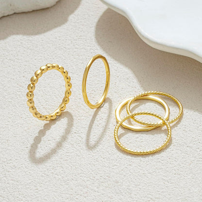 Dainty 14K gold plated rings arranged by size