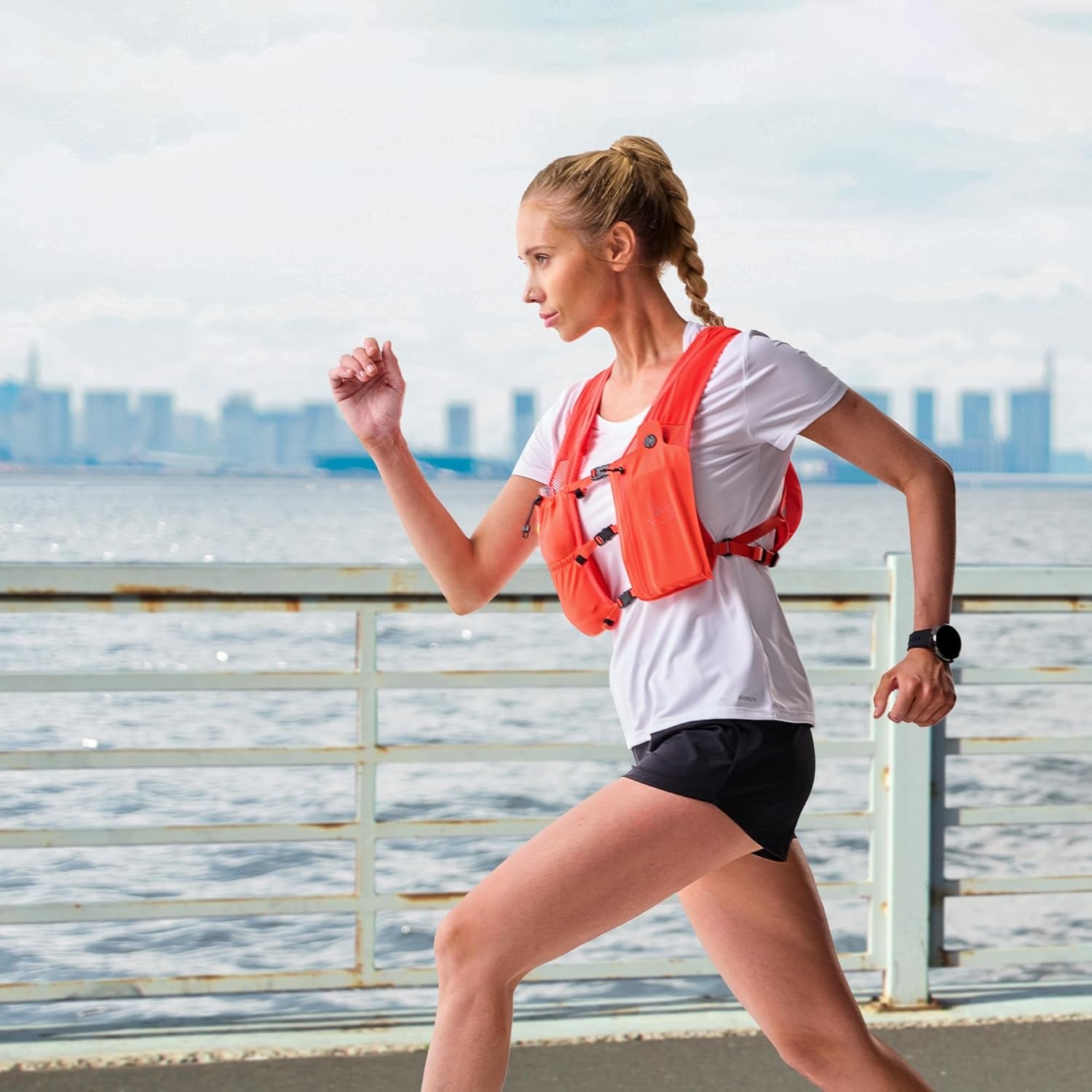 Quick-access flask pocket on running hydration vest