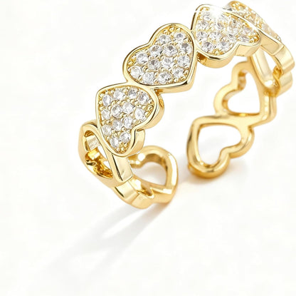 Gold hollow heart ring with cubic zirconia accent stones