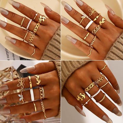 Five gold hoop earrings in different sizes and designs