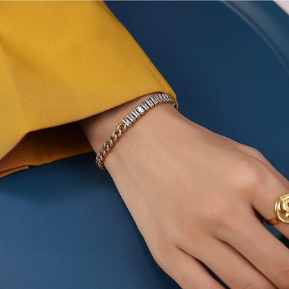 Close up of AD Jewelry gold plated love text engraving on bangle