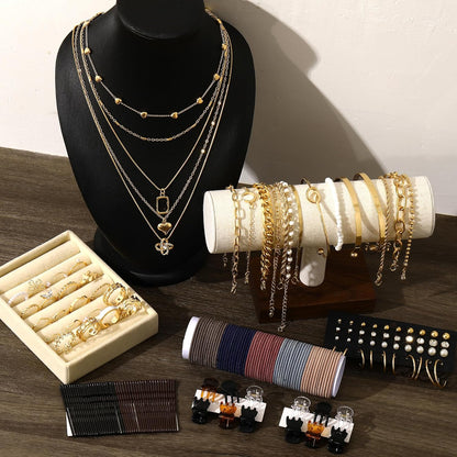 Complete gold jewelry set organized and displayed