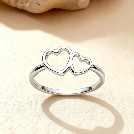 Simple sterling silver double love ring on woman's finger