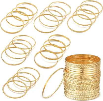 24 piece gold bangle bracelet set displayed in boho stackable arrangement