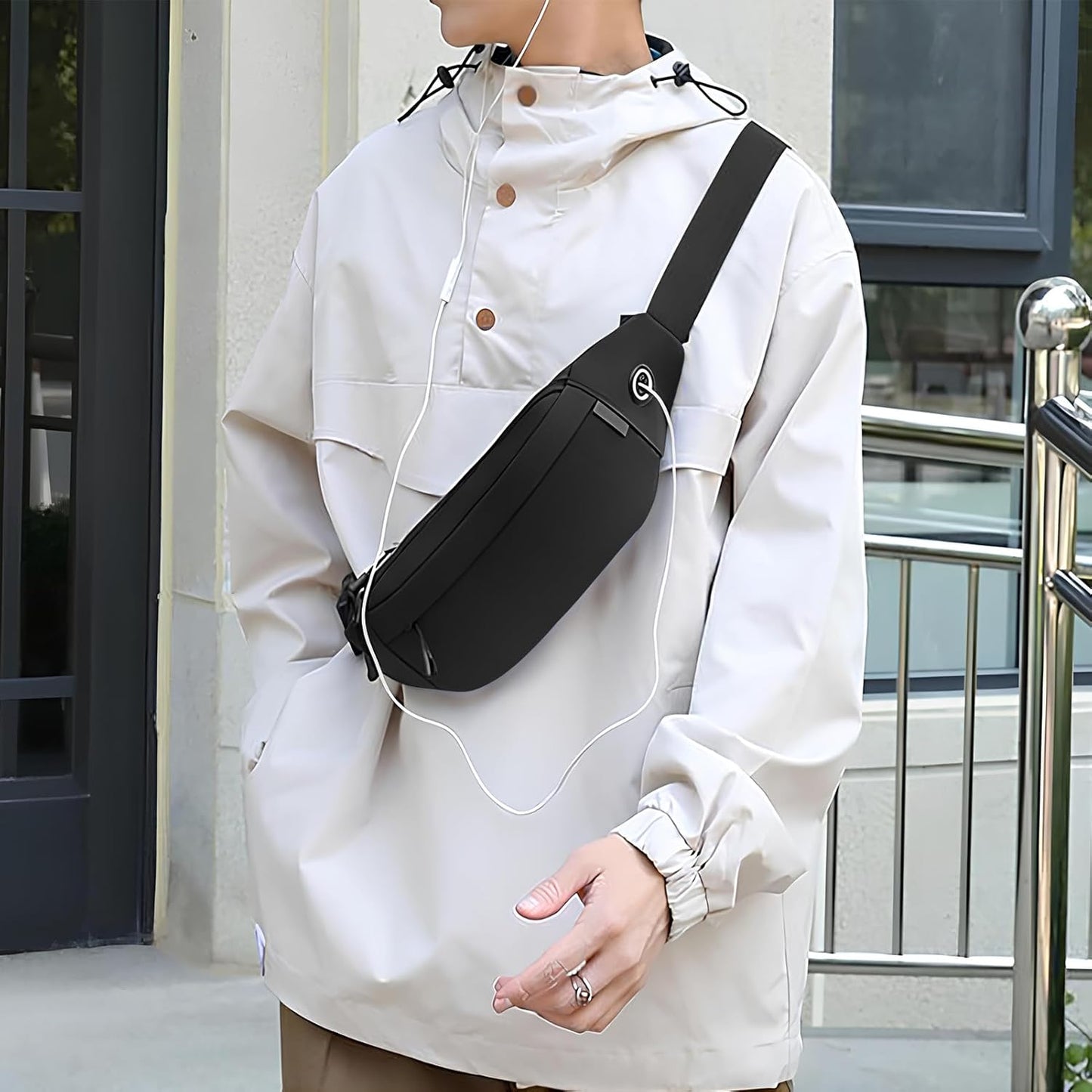 Black large crossbody waist bag worn diagonally across body