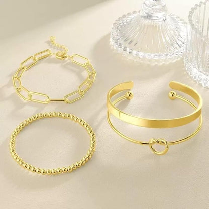 Women wearing stackable gold plated cuff bracelets for trendy look