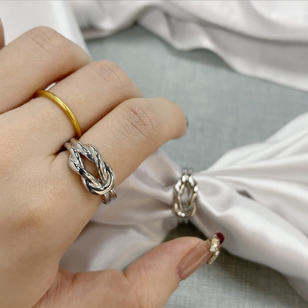 Silk scarf held with decorative knot ring brooch