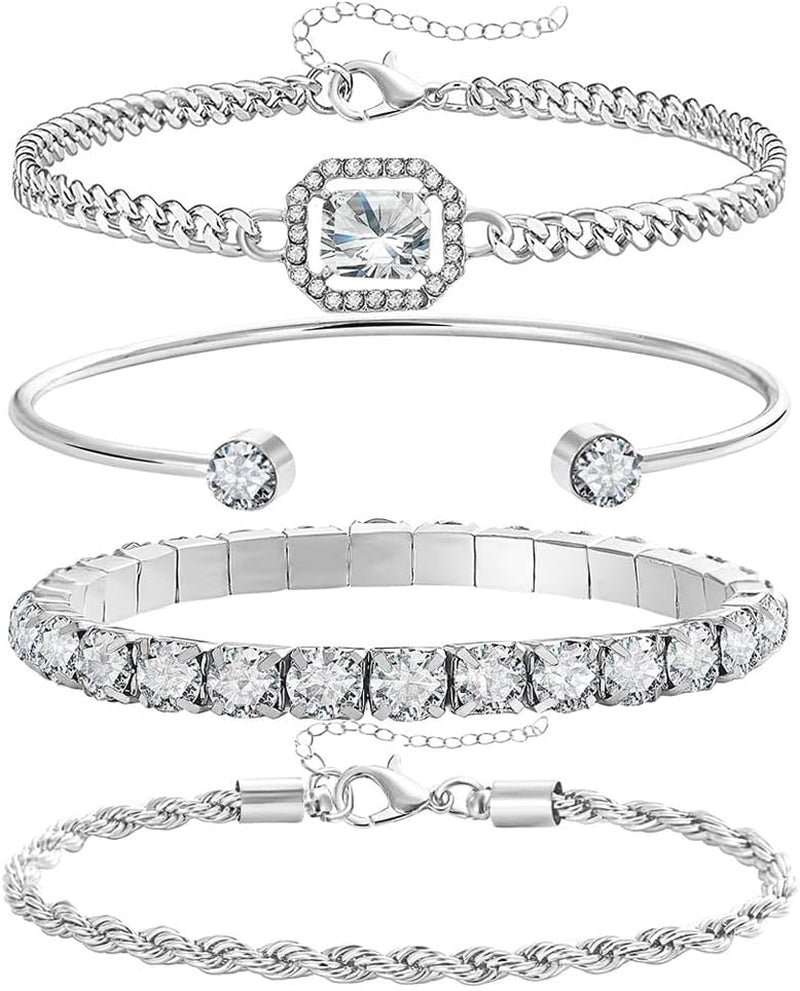 Four-piece gold and silver bracelet set for women displayed together
