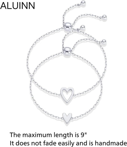 Matching pair of gold heart bracelets stacked together
