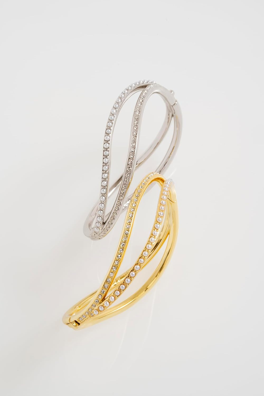 Overhead view of elegant Ted Baker wave pattern bangle bracelet