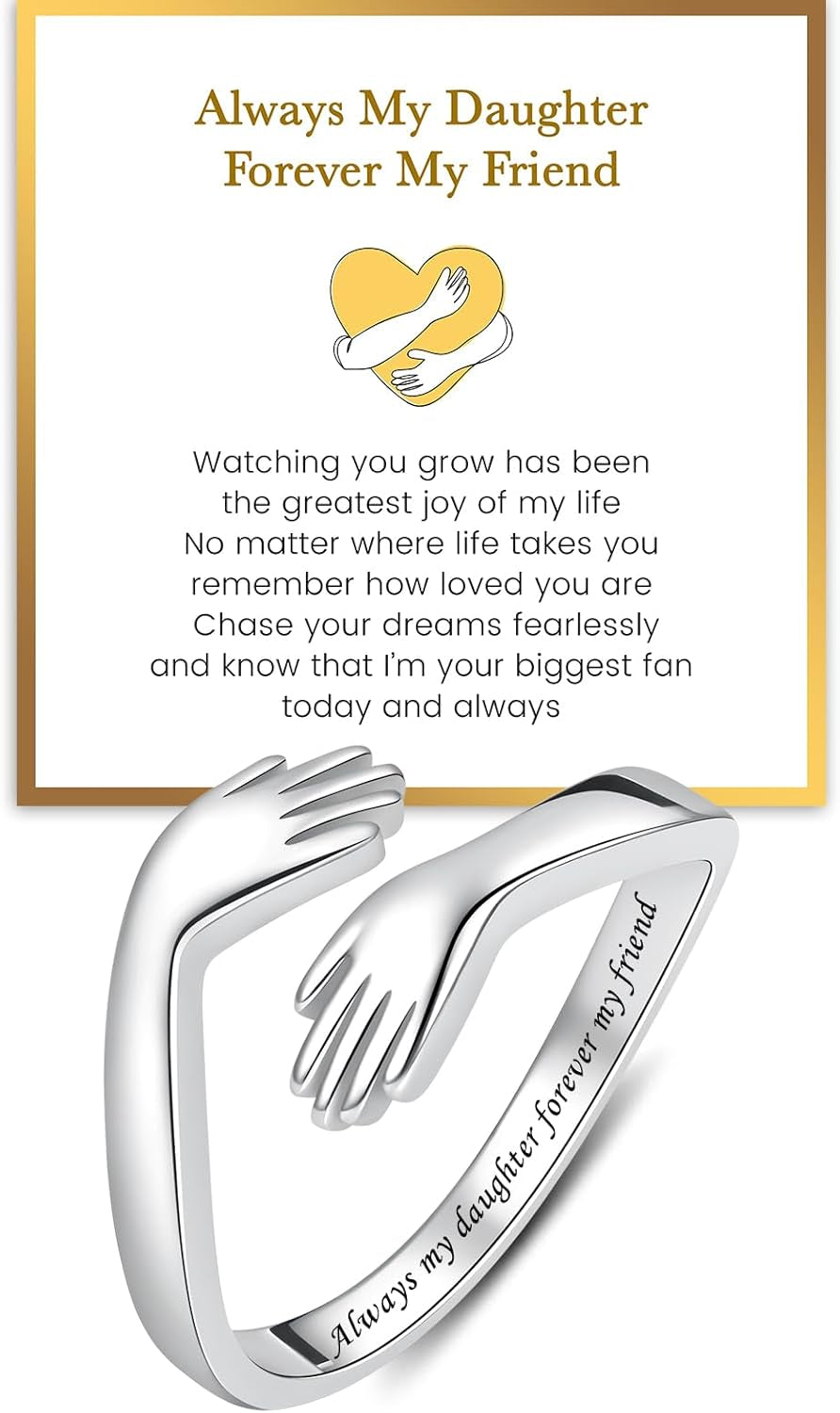 Sterling silver hug ring on woman's hand showing embrace design