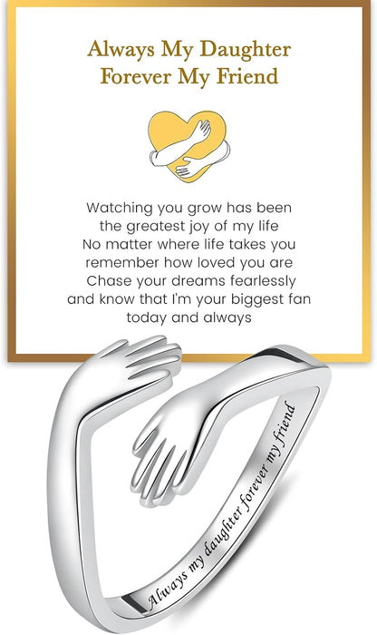 Sterling silver hug ring on woman's hand showing embrace design