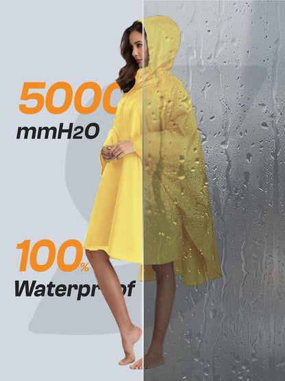 Woman wearing hooded rain poncho with functional pockets