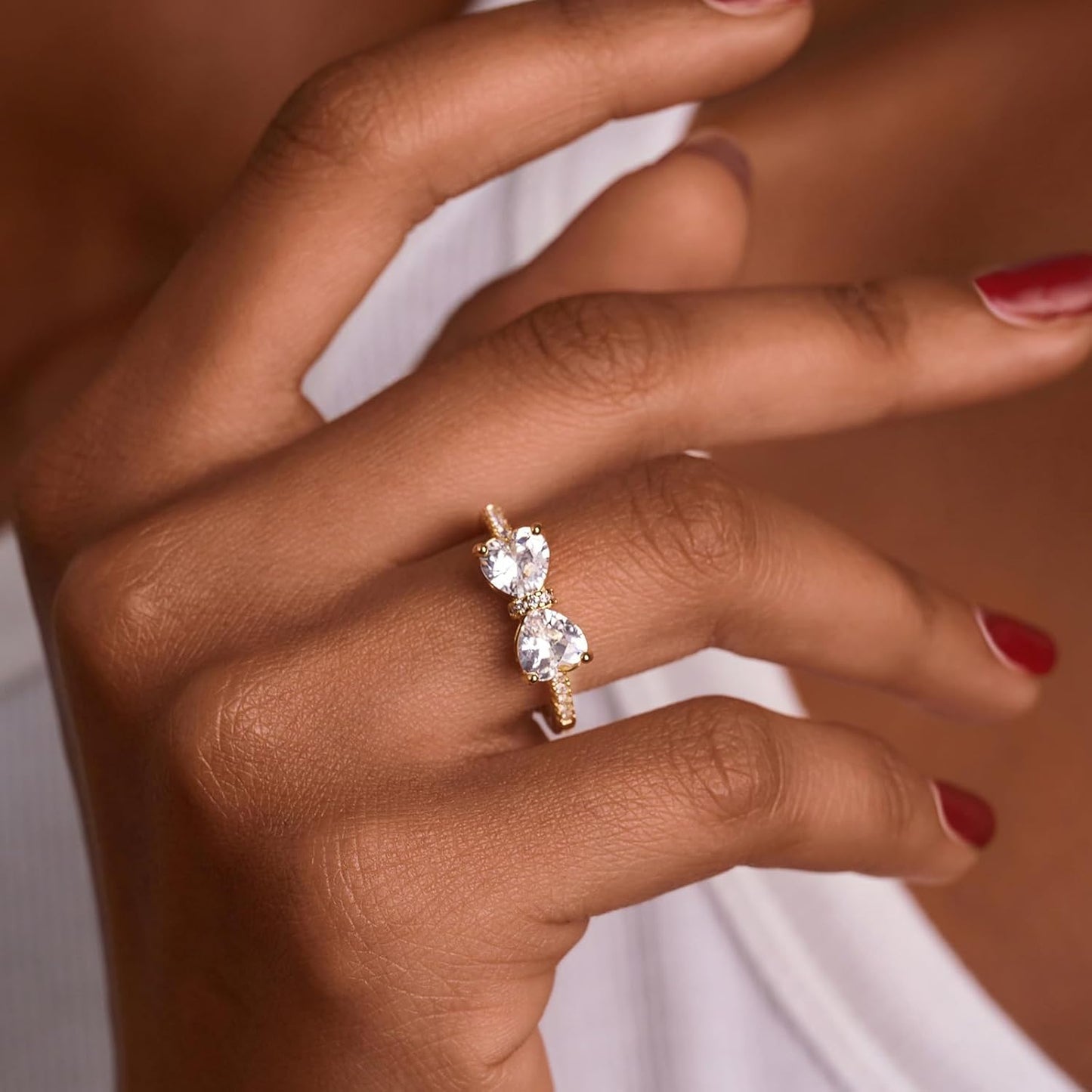 Cubic zirconia eternity bow ring in elegant silver finish