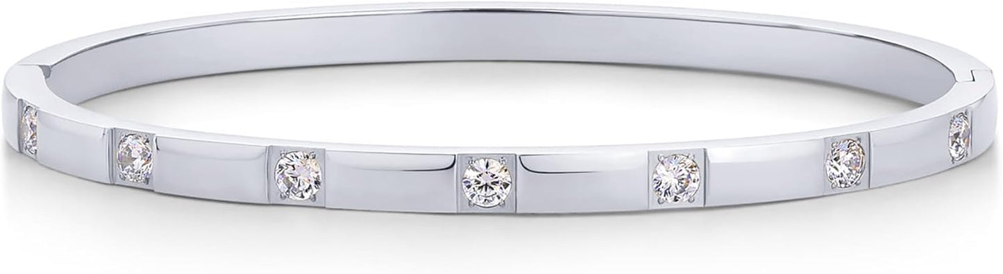 Multiple PAVOI bangles stacked for layered jewelry look