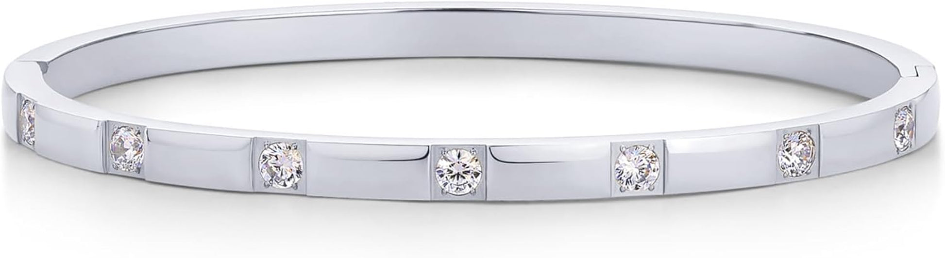 Multiple PAVOI bangles stacked for layered jewelry look