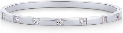 Multiple PAVOI bangles stacked for layered jewelry look
