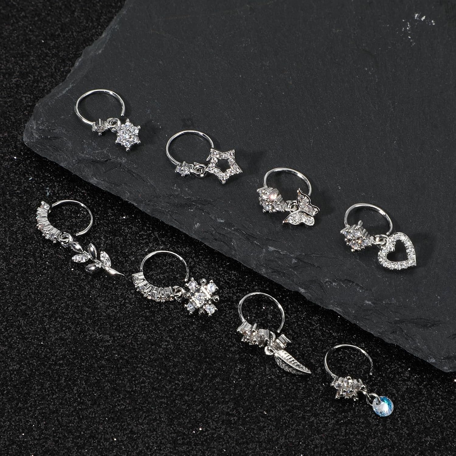 Gold nose hoop earrings collection laid out