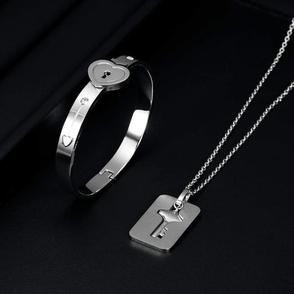 Close-up of heart and key lock charm on bangle bracelet