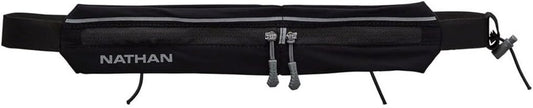 Woman wearing Nathan Mirage compact black running belt during workout