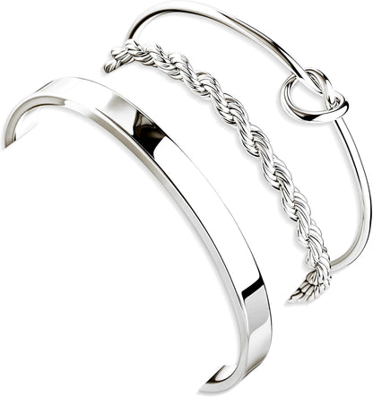 Silver and gold plated stacked cuff bangle bracelets on womens arm