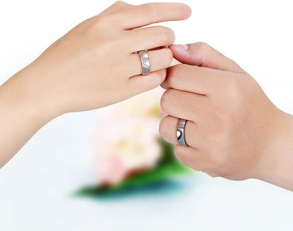 Close-up of interlocking half heart design on promise rings