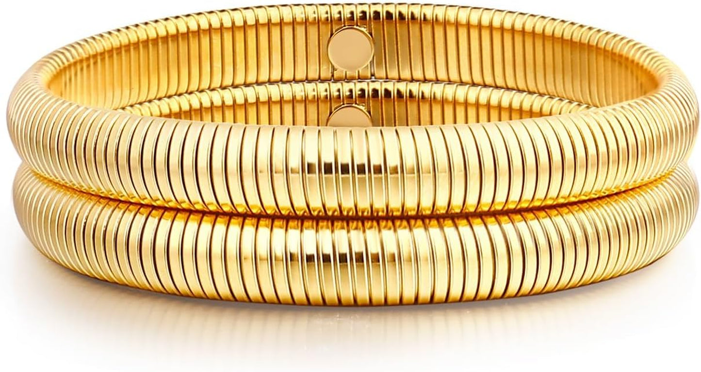 Gold multi-layer stretchy bangle bracelets on woman's wrist
