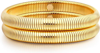 Gold multi-layer stretchy bangle bracelets on woman's wrist