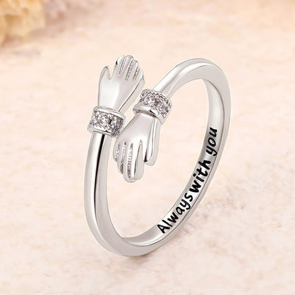 Gold adjustable love hug ring showing sizing flexibility