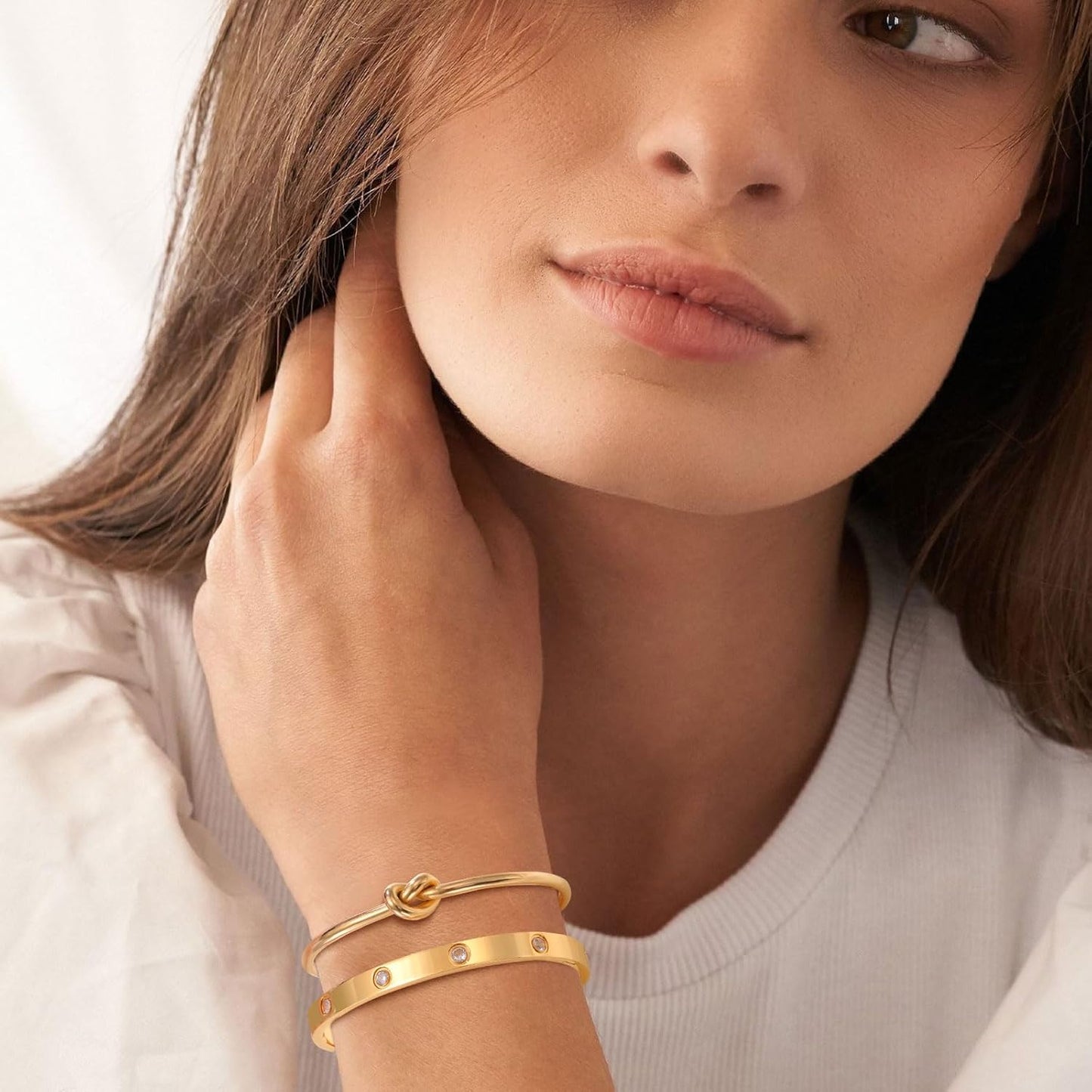 Cubic zirconia tennis bracelet in gold plating on model wrist