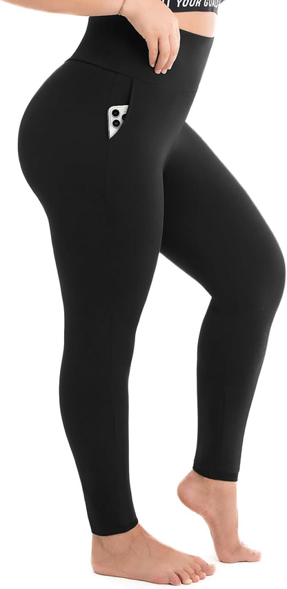Woman wearing black plus size high-waisted leggings with side pockets
