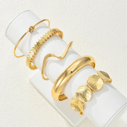 Geometric circle asymmetrical boho gold bangle design