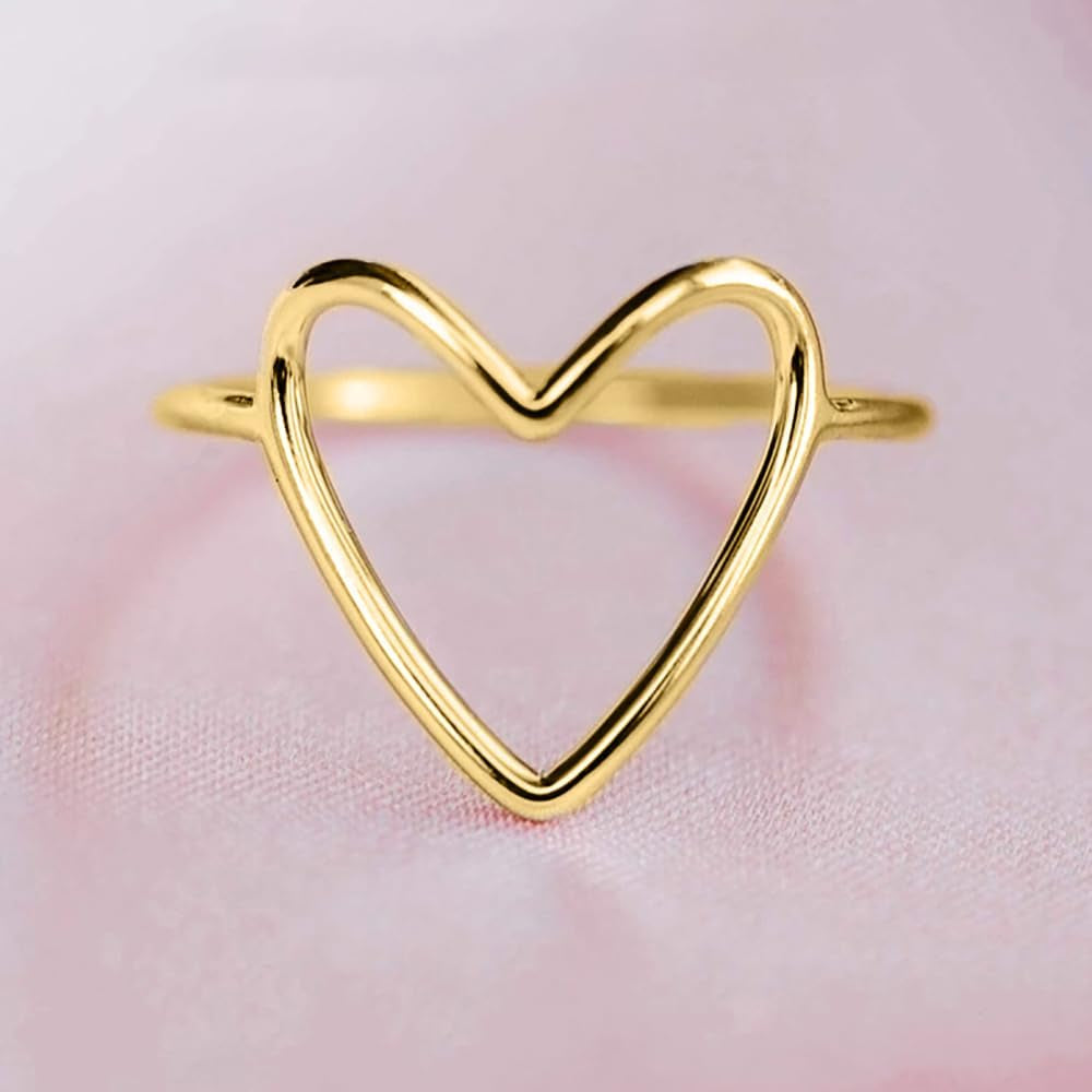 Minimalist heart ring collection showing various metal finishes and styles