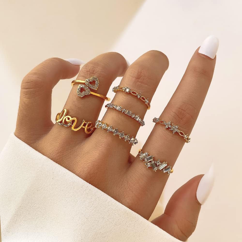 Gold moon star midi rings showing layered stacking style