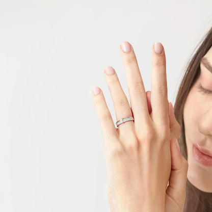 Woman wearing 18K white red gold love knot diamond ring