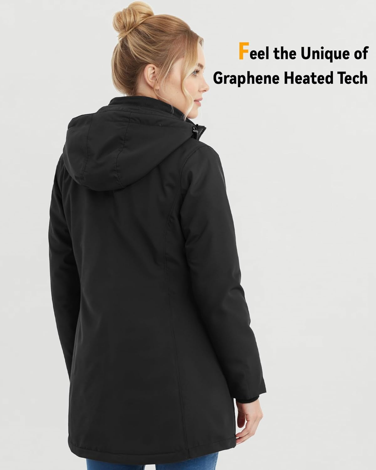 Women's heated jacket modeled in outdoor winter setting