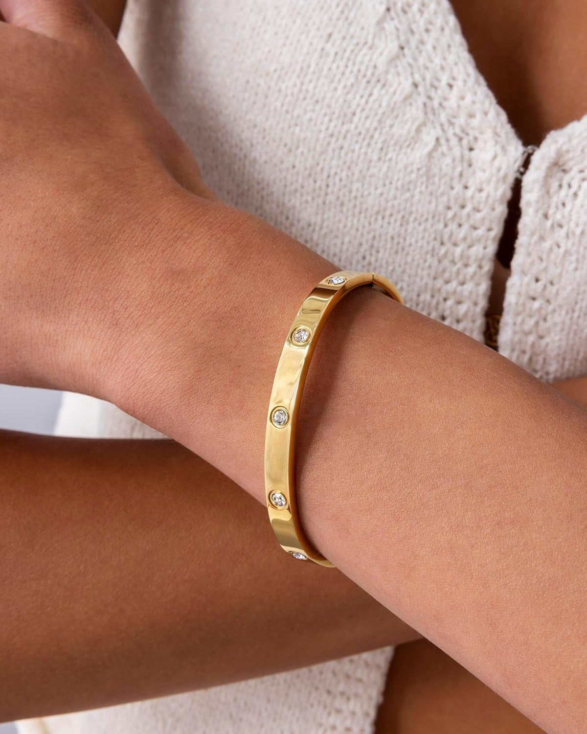 Close-up of waterproof gold plated hinged bangle bracelet design