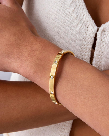 Close-up of waterproof gold plated hinged bangle bracelet design