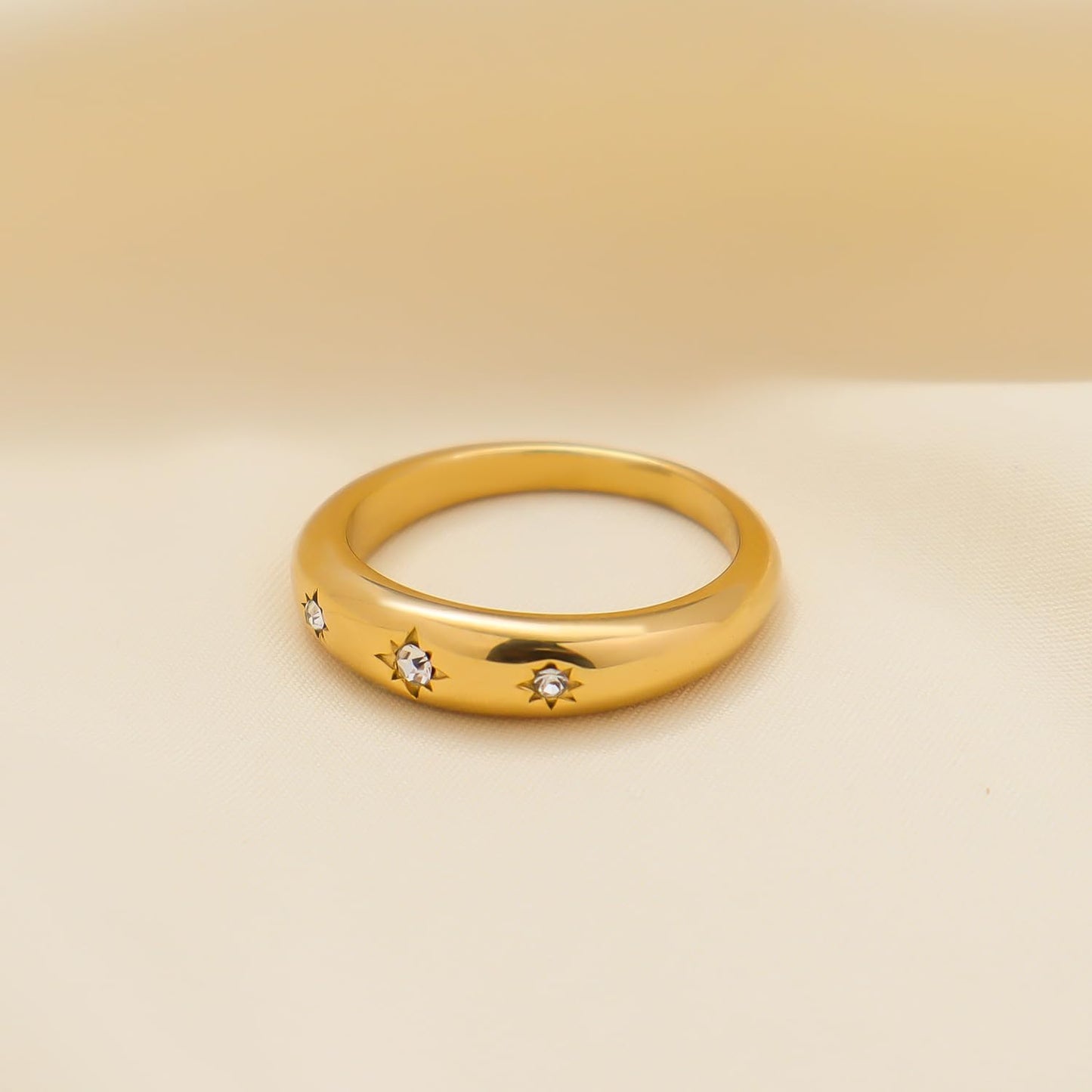Gold statement ring with sparkling cubic zirconia star design