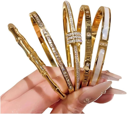 Flat lay of complete gold and silver bracelet set with presentation box