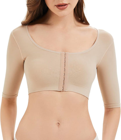 Arm lipo compression sleeves worn under low neckline outfit