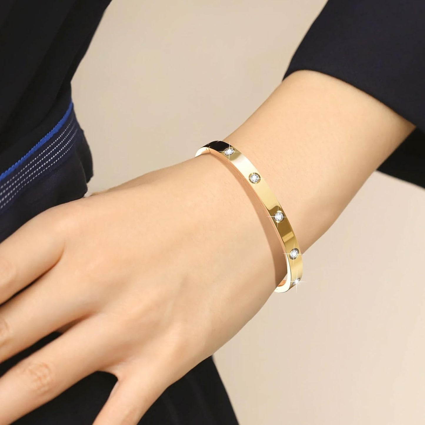 Close-up of gold plated bangle bracelet stacking detail