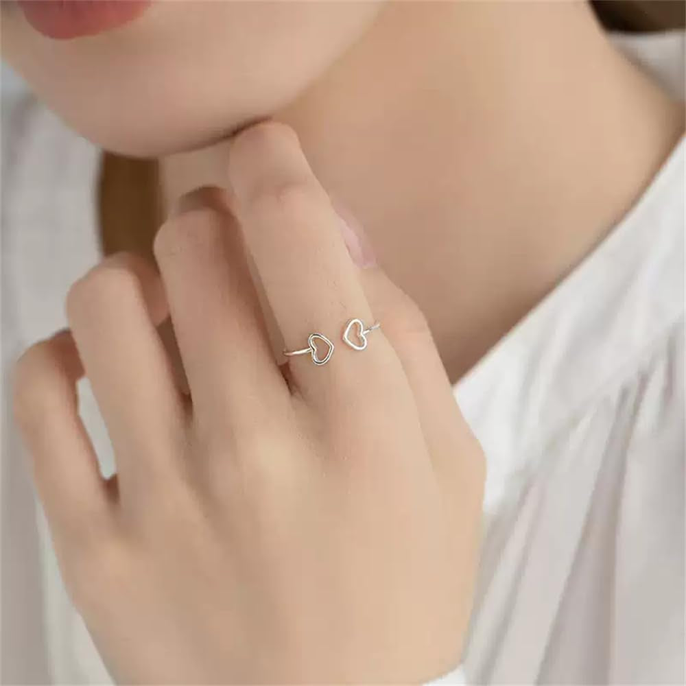 Close-up of dainty double heart S925 sterling silver ring design