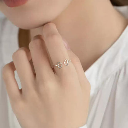 Close-up of dainty double heart S925 sterling silver ring design