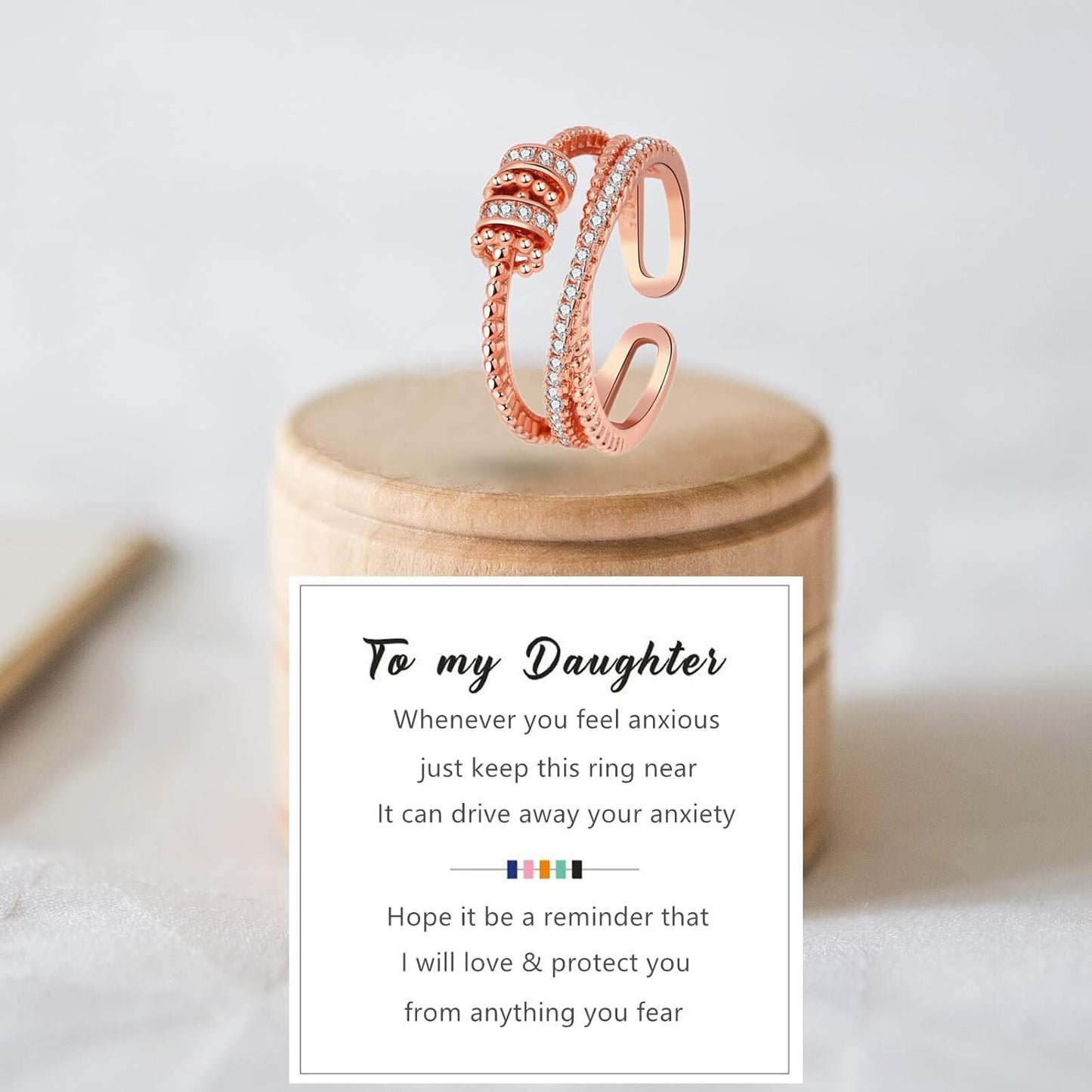 Gold fidget ring with rotating beads for stress relief